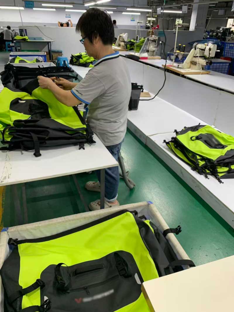 Assembly bench where waterproof motorcycle bags are being put together